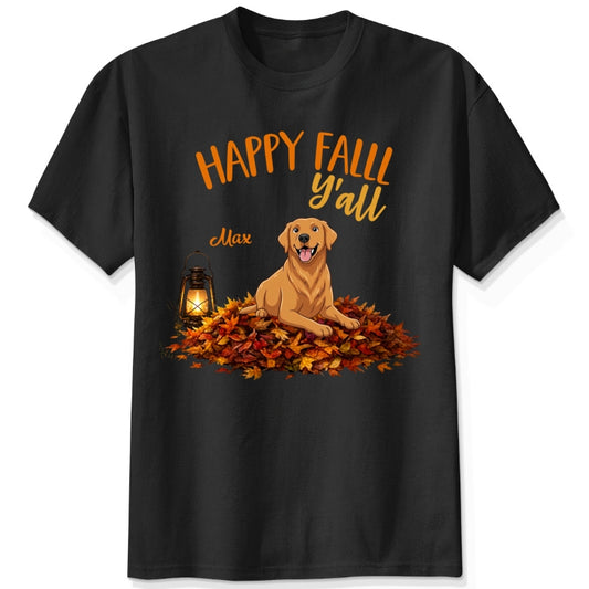 A black short-sleeve crewneck t-shirt featuring a 'Happy Fall Y'all' graphic with custom dogs sitting on a pile of autumn leaves next to a glowing lantern.
