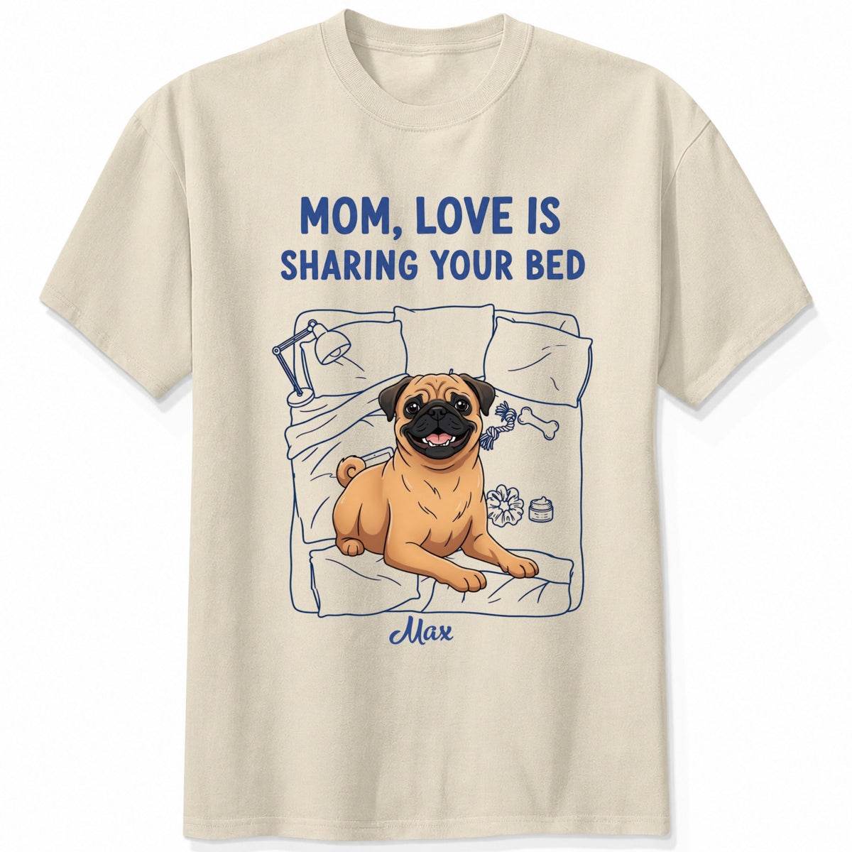 A sand short-sleeve t-shirt with a graphic of a pug dog on a bed and the text 'MOM, LOVE IS SHARING YOUR BED' in blue, with Dog's name written below. Custom with many dog breeds to choose from
