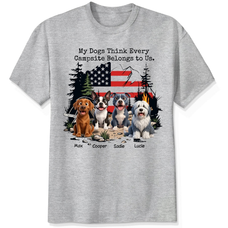 A ash grey short-sleeve t-shirt featuring a graphic print of dogs sitting in front of a campfire and an American flag, with the text 'My Dogs Think Every Campsite Belongs to Us.' and custom with dog's names below.