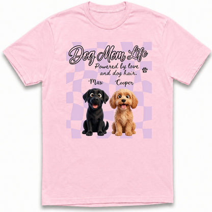 A custom dogs light pink short-sleeve t-shirt with a graphic print on the front. The graphic features the text 'Dog Mom Life' and 'Powered by love and dog hair.