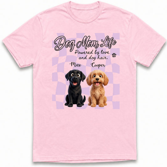 A custom dogs light pink short-sleeve t-shirt with a graphic print on the front. The graphic features the text 'Dog Mom Life' and 'Powered by love and dog hair.