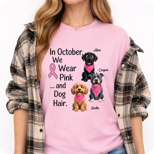 A woman wearing a light pink graphic t-shirt with breast cancer awareness and dog design, styled with an open brown and gray plaid flannel shirt over her shoulders, against a plain white background. Personalized with a wide variety of dog breeds.
