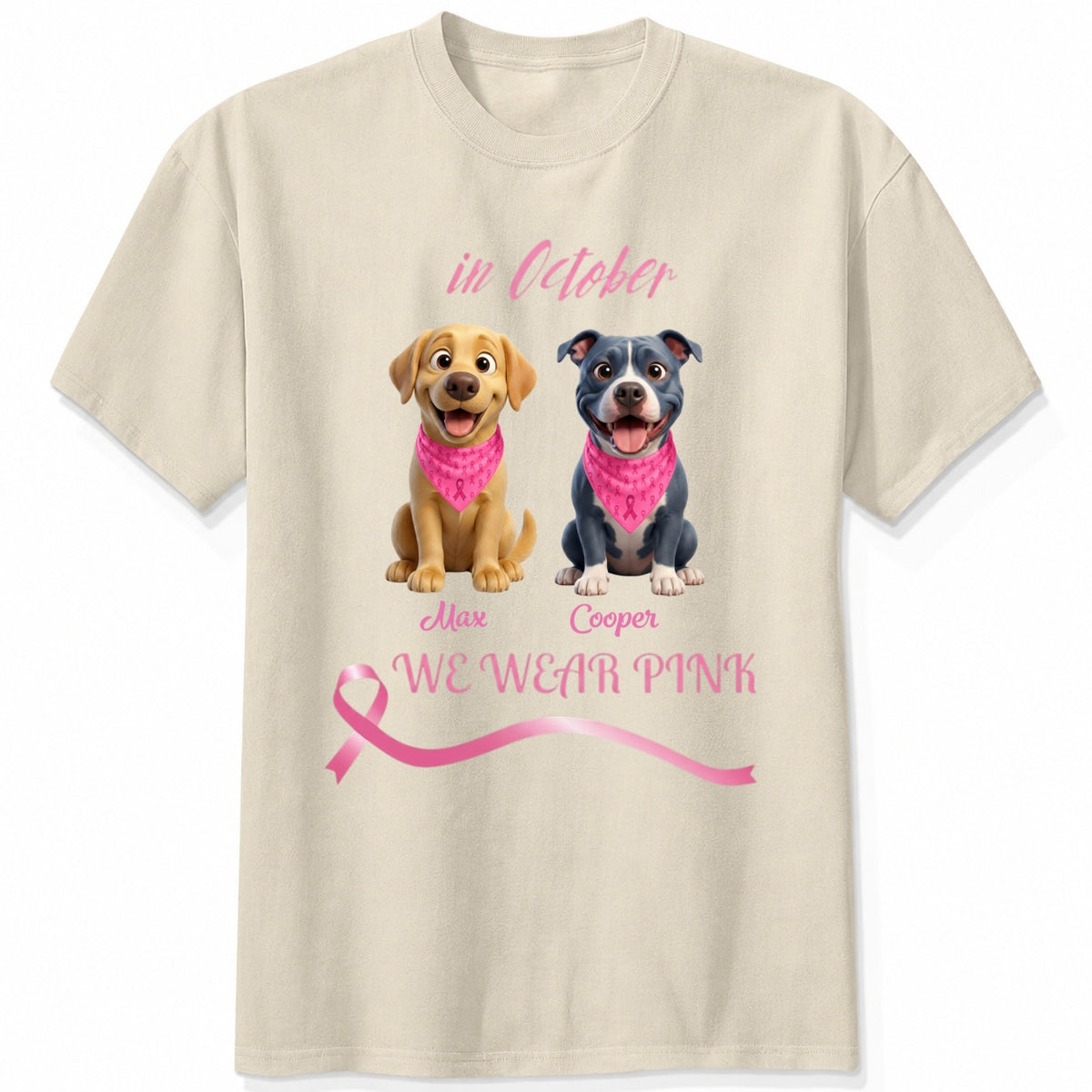 A sand short-sleeve crewneck t-shirt featuring a graphic print of dogs wearing pink bandanas, with the text 'in October', 'WE WEAR PINK' along with a pink ribbon. Personalized with a wide variety of dog breeds