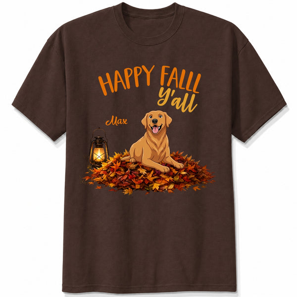 A dark brown short-sleeve crewneck t-shirt featuring a 'Happy Fall Y'all' graphic with custom dogs sitting on a pile of autumn leaves next to a glowing lantern.