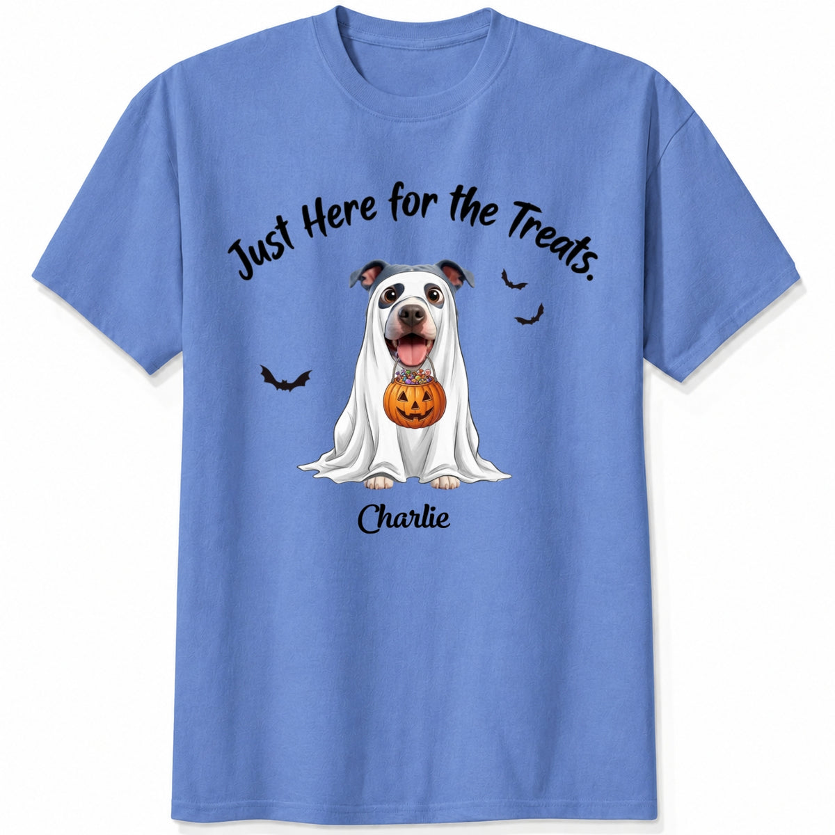 A blue t-shirt featuring a cartoon graphic of a dog dressed in a white ghost holding a jack-o'-lantern, with the text 'Just Here for the Treats.' and custom with dog's name printed below