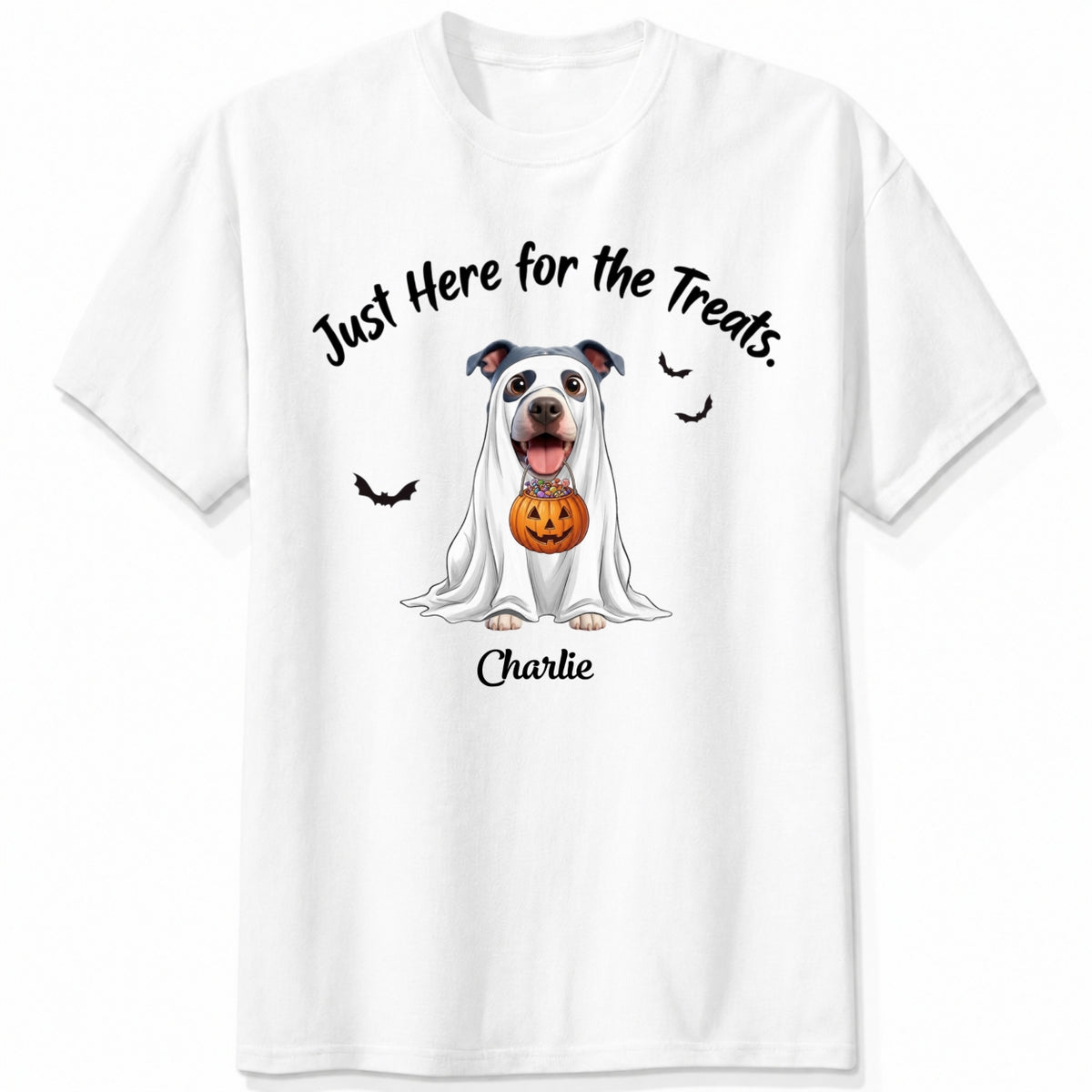 A white t-shirt featuring a cartoon graphic of a dog dressed in a white ghost holding a jack-o'-lantern, with the text 'Just Here for the Treats.' and custom with dog's name printed below