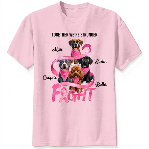 A light pink short-sleeve crewneck t-shirt featuring a custom graphic for breast cancer awareness. The design shows dogs wearing pink neckties under the text 'TOGETHER WE'RE STRONGER.
