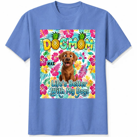 A blue custom dogs short-sleeve t-shirt featuring a colorful front graphic with the text 'DOG MOM' and 'Life's Better With My Dogs' alongside a cartoon dog and tropical floral background.