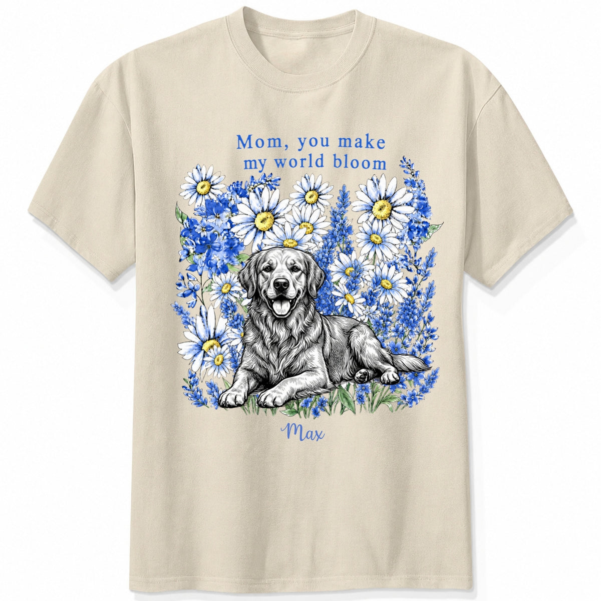 A sand custom dogs t-shirt featuring a graphic print of a golden retriever dog surrounded by blue flowers, with the text 'Mom, you make my world bloom' and dog's name written below.