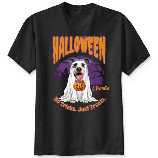 A custom 1-4 dogs black t-shirt featuring a Halloween graphic of dogs dressed as a ghost holding a pumpkin, with the text 'HALLOWEEN', 'No Tricks. Just Treats.
